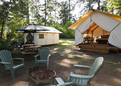 Large and small cabins with blue chairs