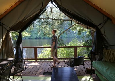 Man outside of cabin looking toward Lakedale