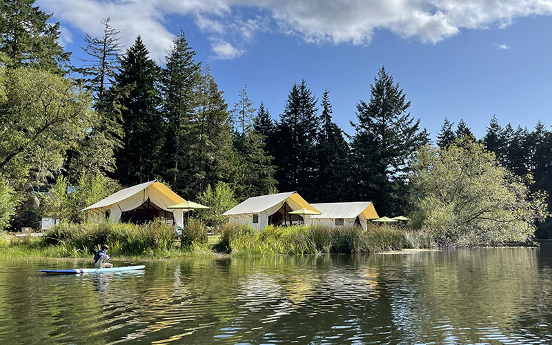 Glamping at Lakedale with boy paddleboarding